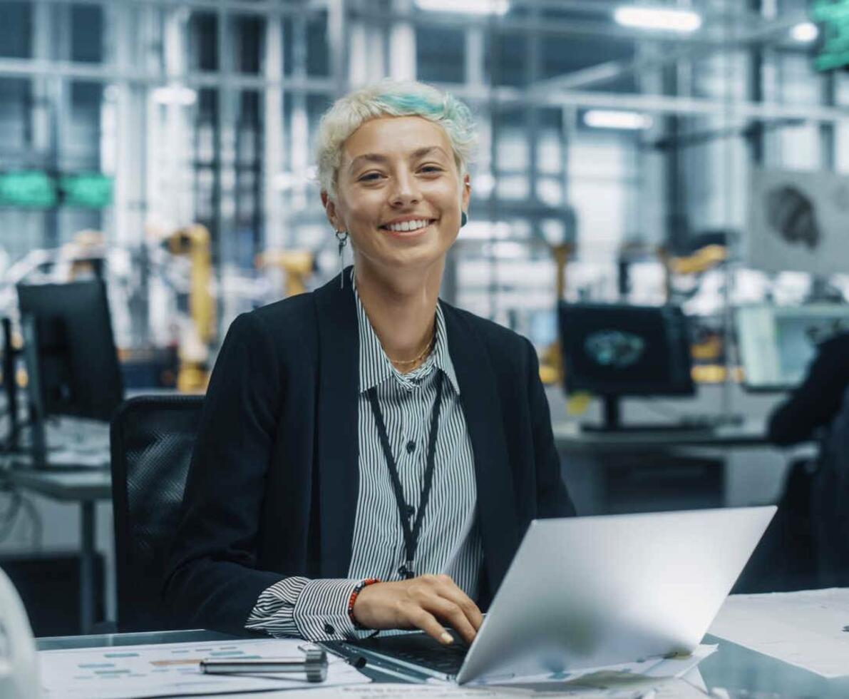 Backend_developer_female_sitting_at_a_computer_laptop