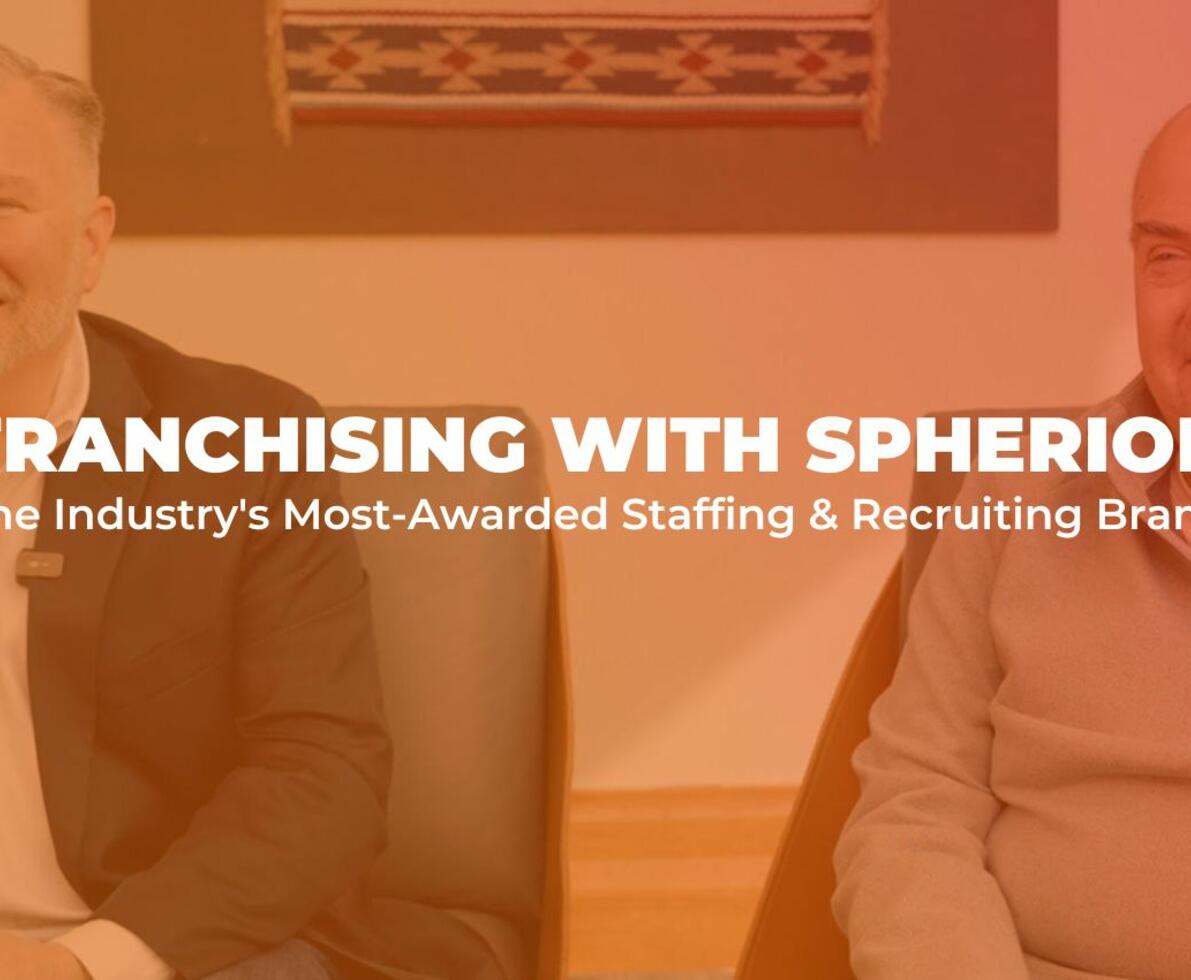 Orange tinted photo of two men smiling with the words Franchising with Spherion, The industry's most awarded staffing & recruiting brand