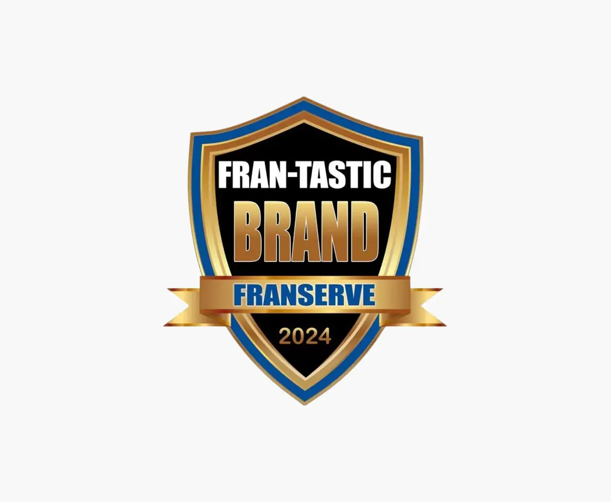 A blue and gold shield badge that reads Fran-Tastic Brand Franserve 2024