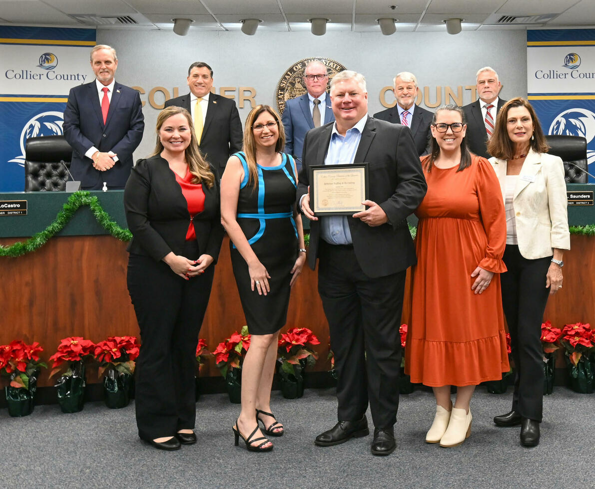 A group of Spherion professionals poses for the camera at the Greater Naples Chamber of Commerce meeting on Dec. 10, 2024