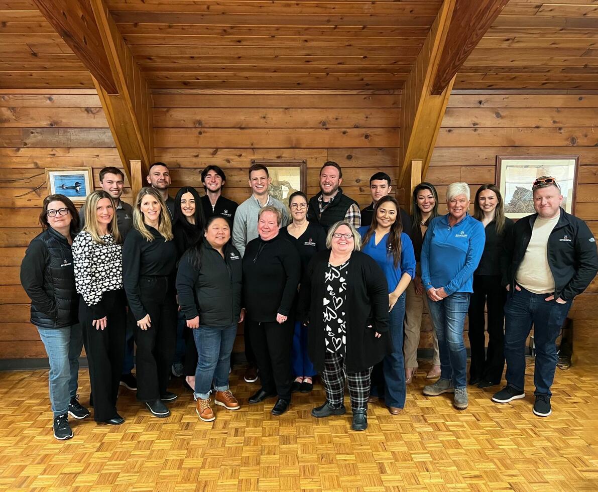 A group of smiling staffing professionals