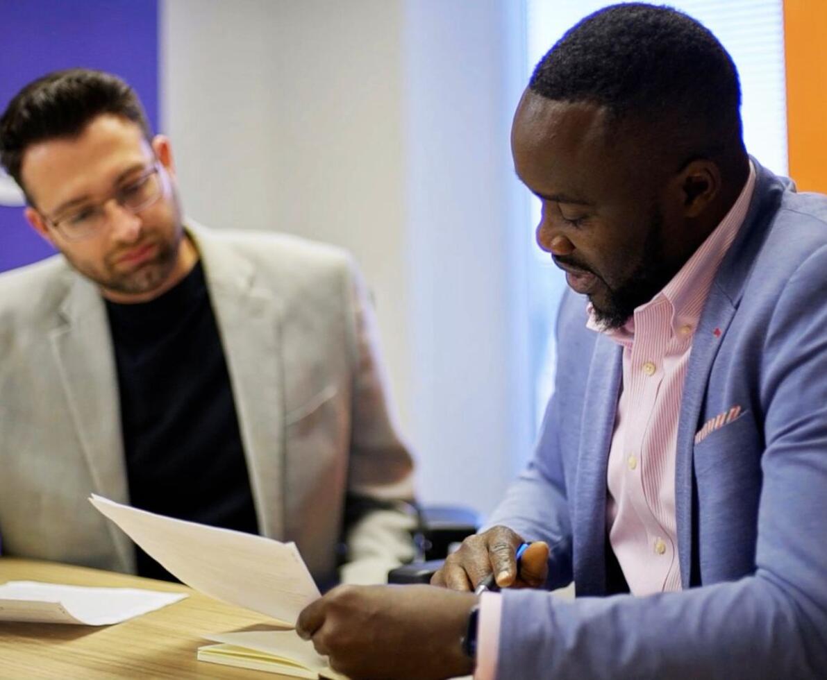 Two men looking over paperwork