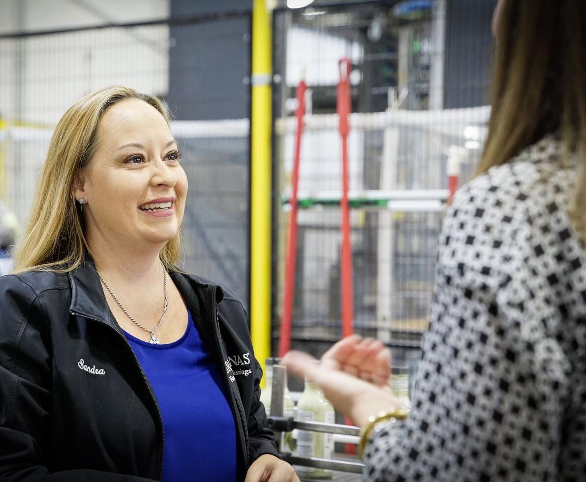 A staffing client talking with a Spherion business manager