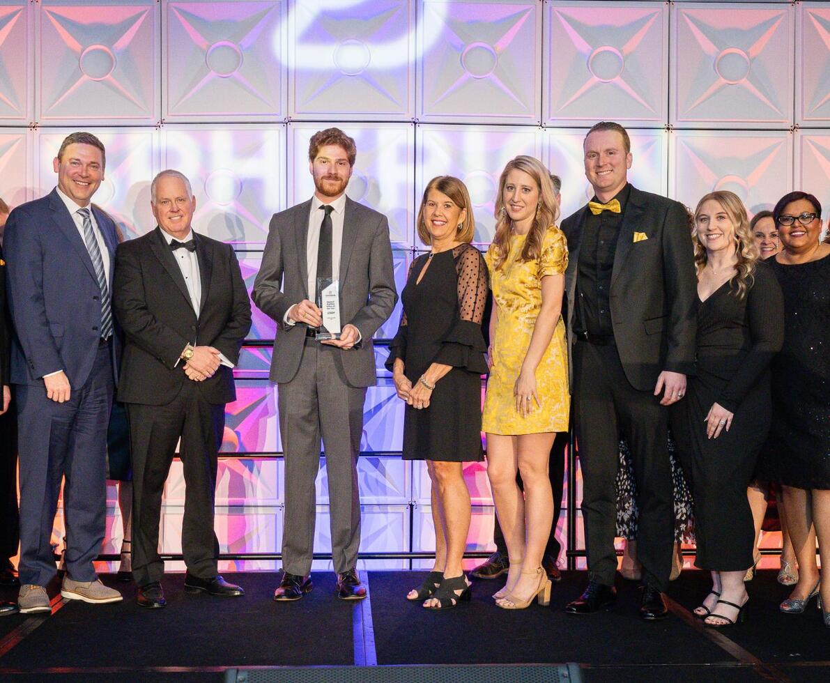 A grop of Spherion professionals on stage to accept an award
