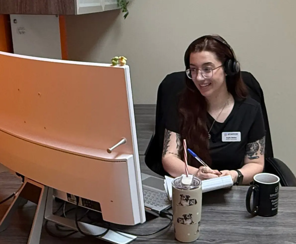 A skilled trades staff recruiter working in an office