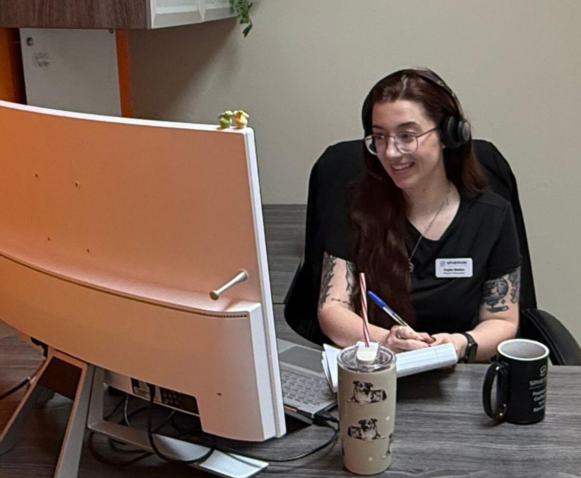 A skilled trades staff recruiter working in an office