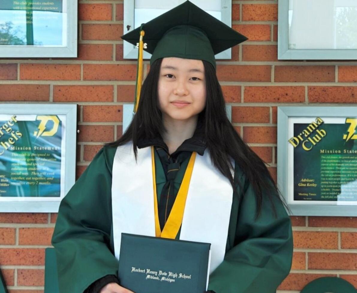 A woman in a cap and gown