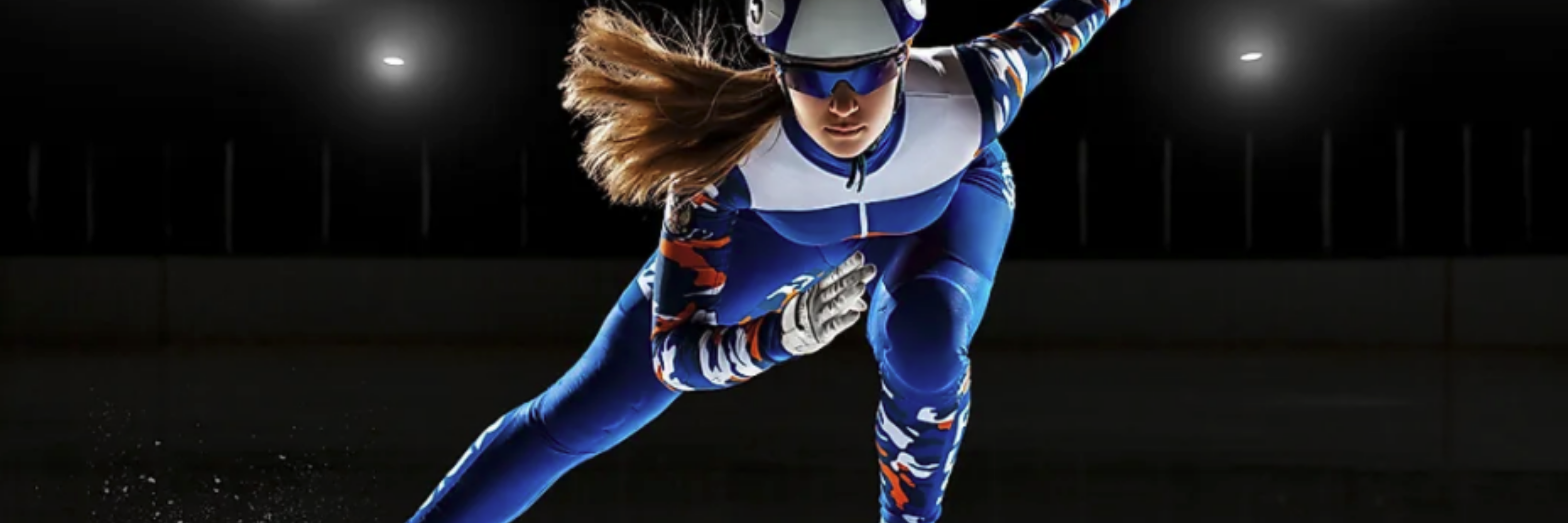 Speed skater woman against a dark background