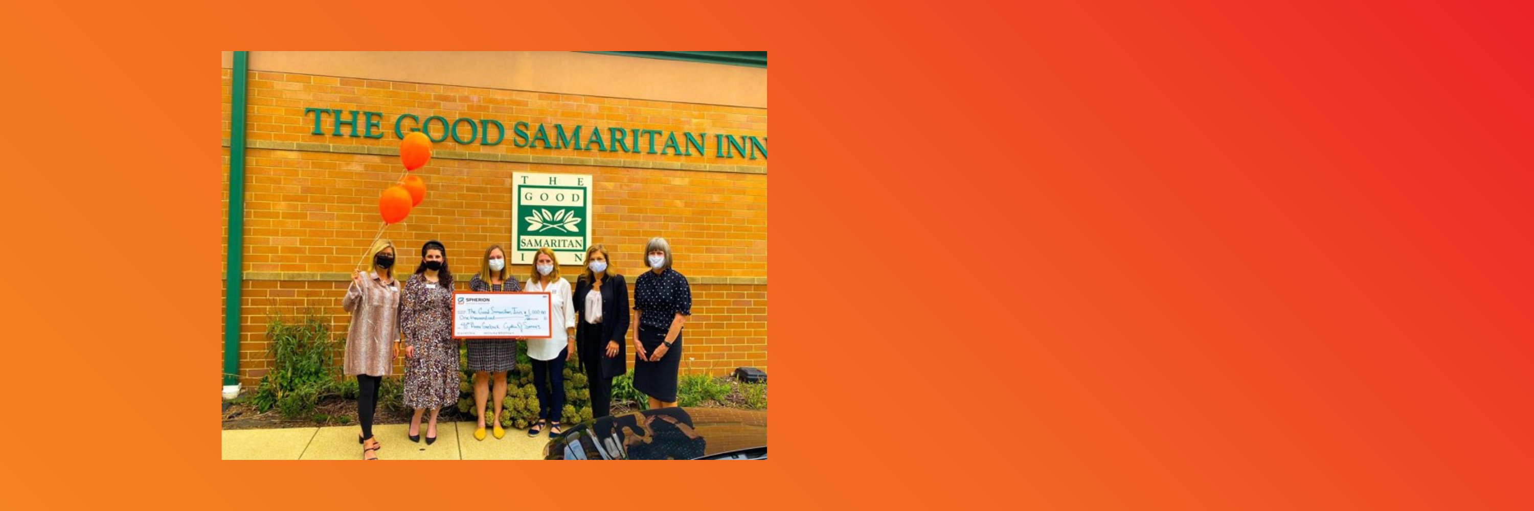 Spherion Champaign staff pose with a check donated to The Good Samaritan Inn