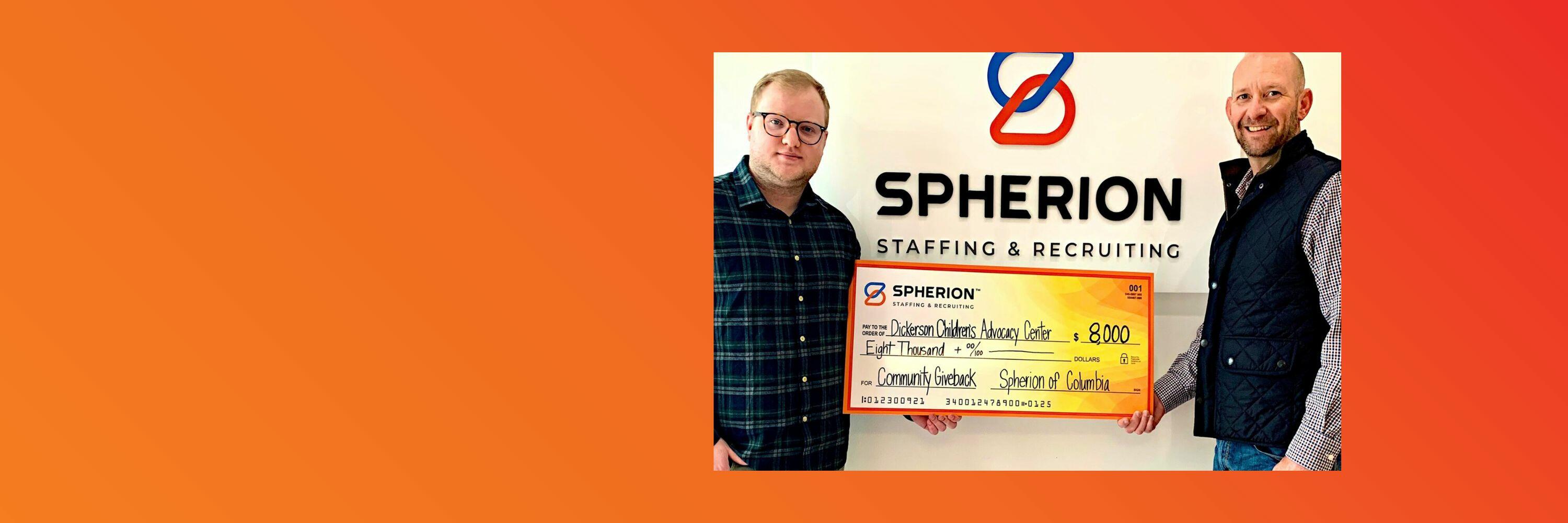 Orange banner with a photo of two Spherion employees presenting a check to the Dickerson Children's Advocacy Center