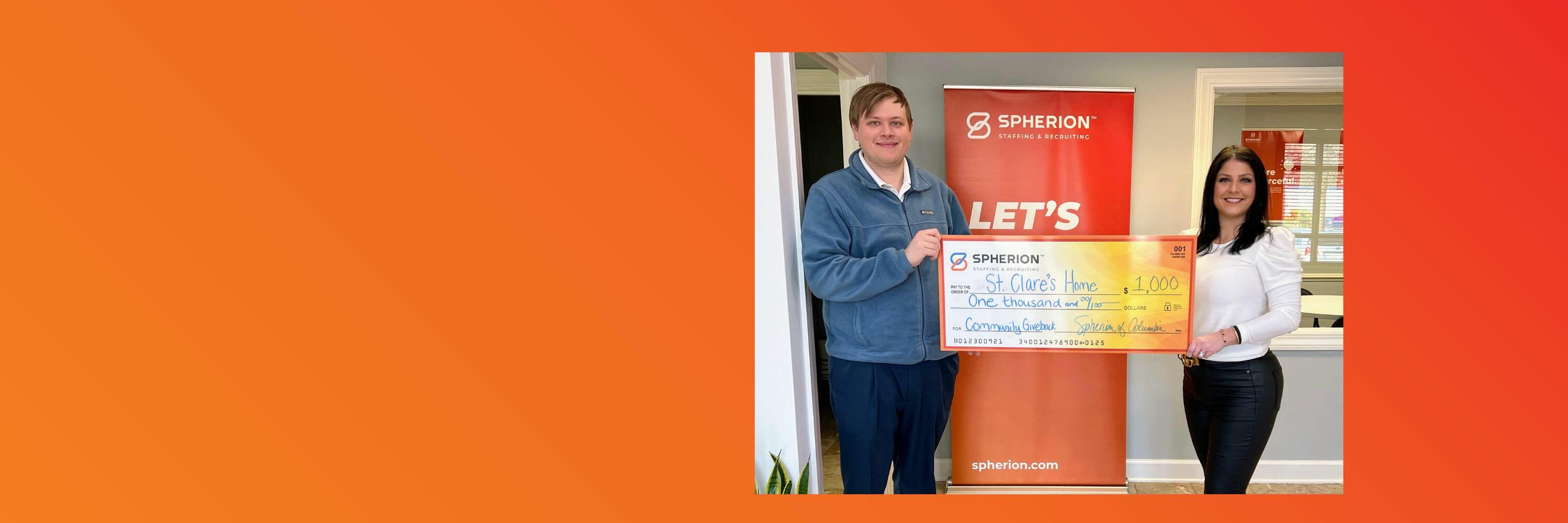 Orange background with a photo of two people holding a giant check for $1,000 on the right side