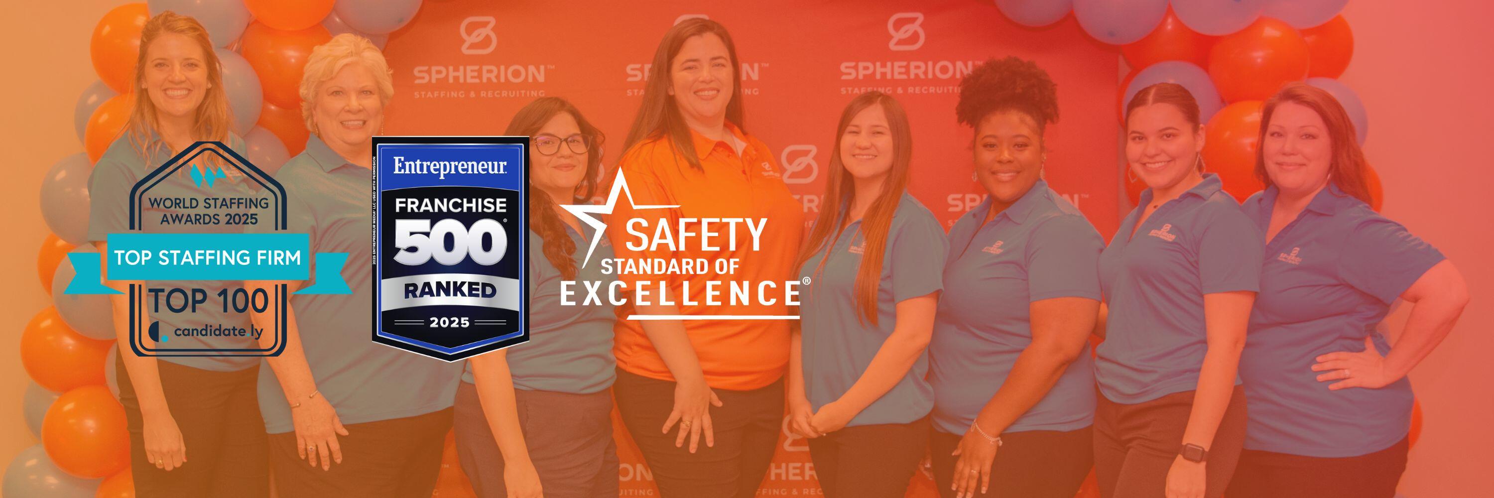 A group of women smiling and standing in front of a Spherion background with three award badges in the foreground