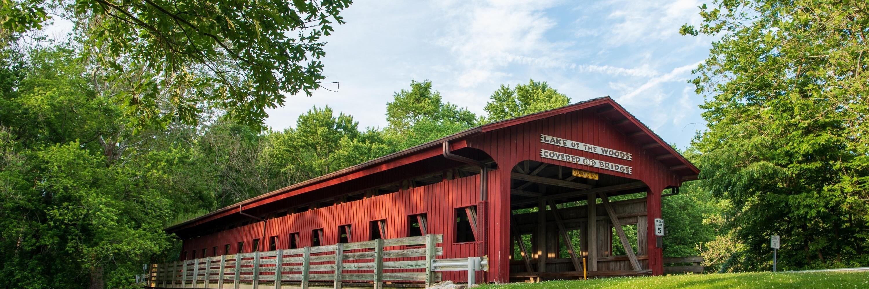 A photo of a red covered bridge in Lake of the Woods, Illinois