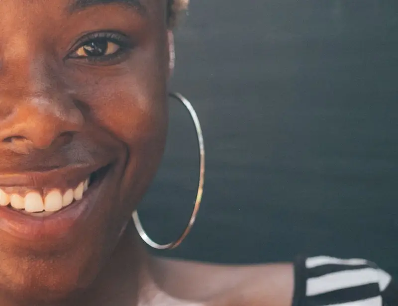 African-American teacher smiling at the camera