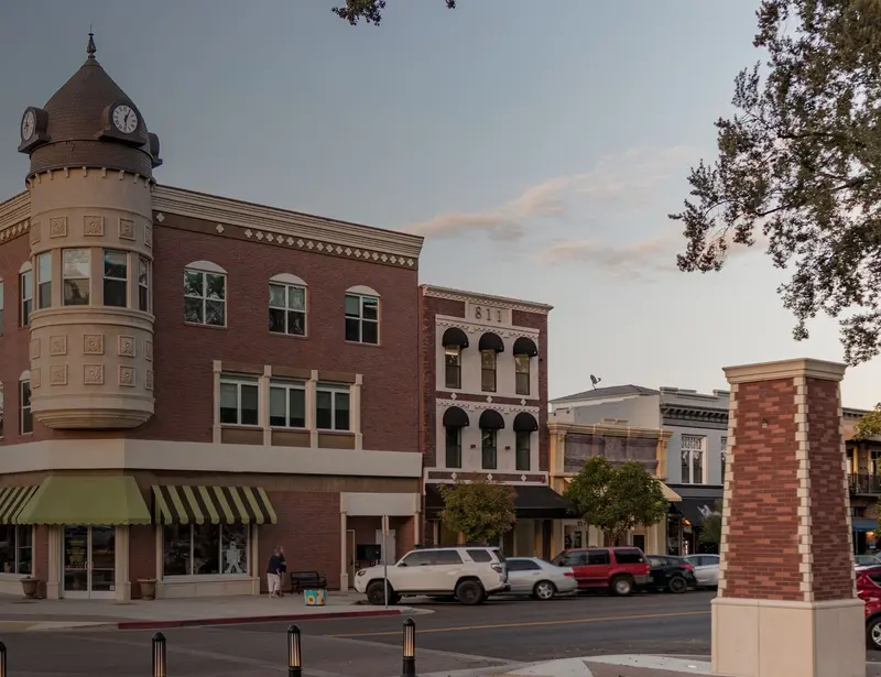 Photo of a tan and brick office building in downtown Paso Roles, California