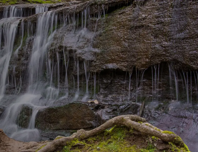 A waterfall flowing down a cliff face