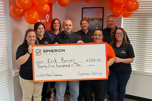 Erik Reeves poses with his $2500 check and members of Spherion's North Dartmouth, Massachusetts office