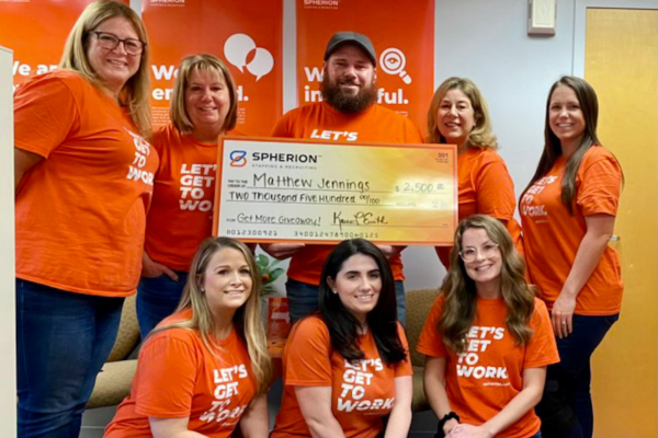 Matthew Jennings poses with his check and members of Spherion's North Dartmouth, Massachusetts office