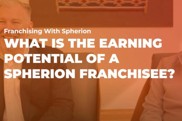 Orange tinted photo of a smiling man with the words Franchising with Spherion, What is the Earning Potential of a Spherion Franchisee?