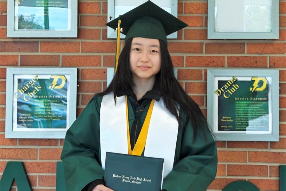 A woman in a cap and gown