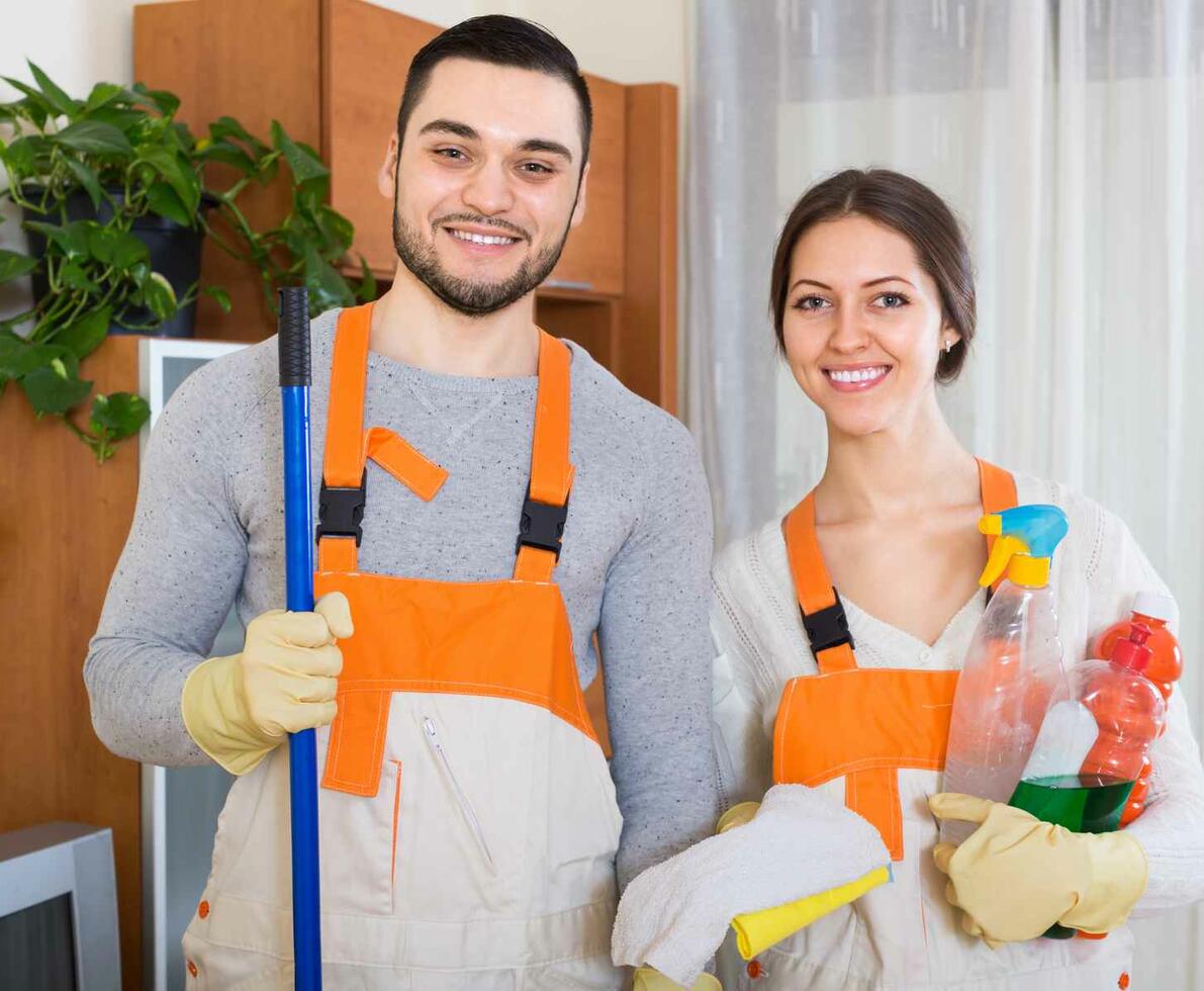 Cleaners_man_and_woman_in_orange_aprons